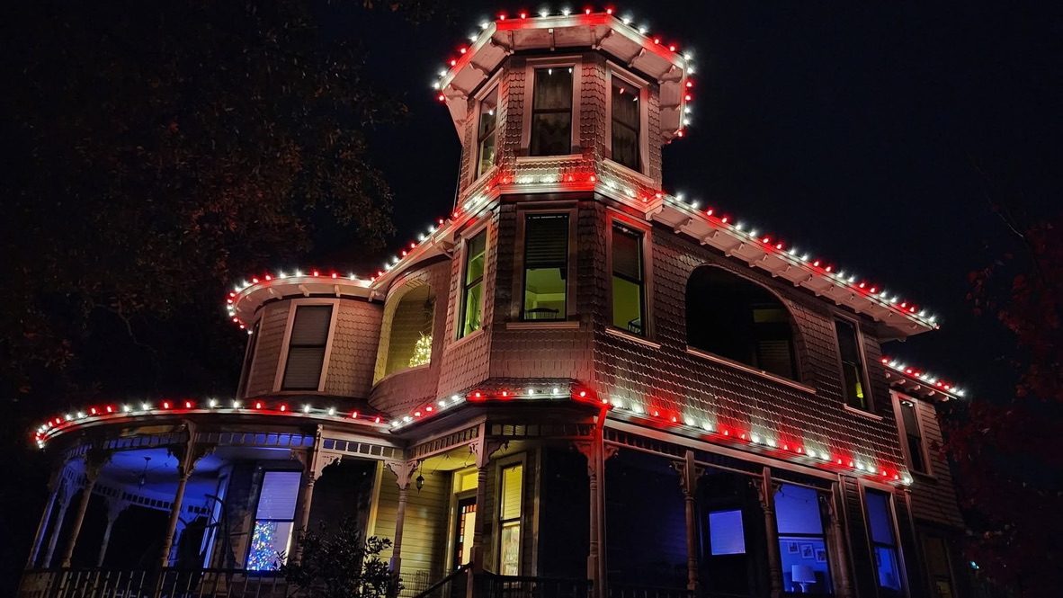 Permanent roofline lighting — one home shown in different color schemes